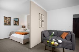 A bed or beds in a room at Boutique Hotel Bristol