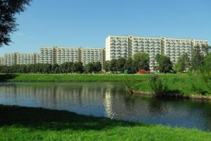 a large building in the background with a river at Może nad morze in Gdańsk