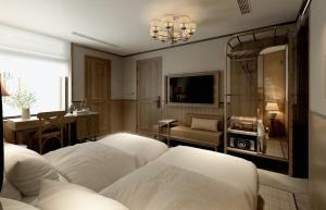 TV a/nebo společenská místnost v ubytování La Passion Hanoi Hotel & Spa