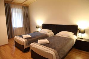 Ένα ή περισσότερα κρεβάτια σε δωμάτιο στο Hotel Chubu