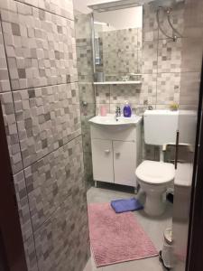 Kúpeľňa v ubytovaní Apartmani Roxy