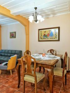 a dining room with a table and chairs at Achi's House in Lefkada