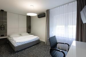 Łóżko lub łóżka w pokoju w obiekcie Hotel Maria