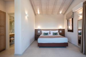 En eller flere senger på et rom på Villa Vardina
