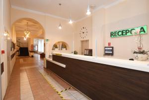 a lobby of a hospital with a reception counter at Centrum Kołobrzeg in Kołobrzeg