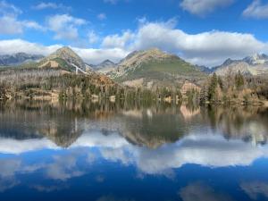 a view of a lake with mountains in the background at No.1 Apartment House Oliver in Štrbské Pleso