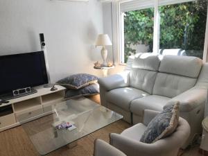 TV a/nebo společenská místnost v ubytování Urbanizacion Puerto Rey