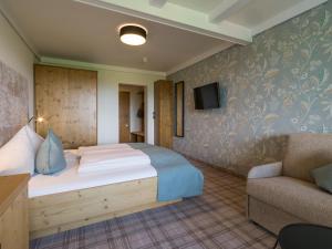Łóżko lub łóżka w pokoju w obiekcie Hotel Streklhof