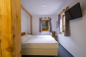 Posteľ alebo postele v izbe v ubytovaní Hotel Hvezda