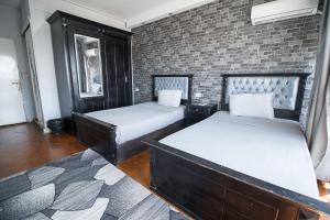 Ένα ή περισσότερα κρεβάτια σε δωμάτιο στο Castle Hostel