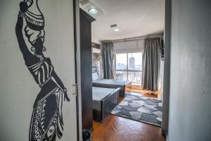 Ένα ή περισσότερα κρεβάτια σε δωμάτιο στο Castle Hostel