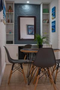 a dining room with a table and chairs at 16 st Johns - Apartment in Port Shepstone