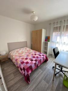 a bedroom with a bed and a table and a desk at Bel Appartement Residence Mirabeau in Aix-en-Provence
