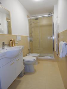 a bathroom with a sink and a toilet and a shower at Casa vacanza Grace in Ravello
