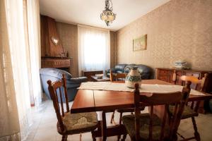 a room with a table and chairs and a dining room at Casa Vacanze Dante in Gorfigliano