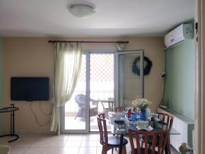 A television and/or entertainment centre at Sior Dionysios Apartments