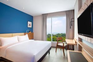 Televiisor ja/või meelelahutuskeskus majutusasutuses ibis Styles Bogor Pajajaran