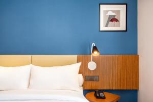 Voodi või voodid majutusasutuse ibis Styles Bogor Pajajaran toas