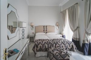 Postel nebo postele na pokoji v ubytování Apartamentos Abreu Suites + 78 fotografií