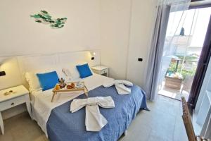 Ένα ή περισσότερα κρεβάτια σε δωμάτιο στο Loft Exotic - 100 metri dalla spiaggia e dal mare di Fontane Bianche