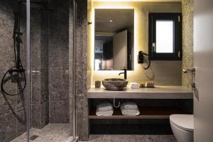 a bathroom with a shower and a sink and a toilet at Bob W Athens Akadimia in Athens