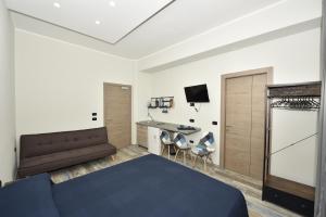 En eller flere senger på et rom på Urban Rooms Salerno