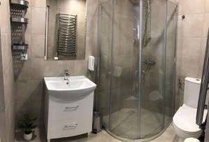 a bathroom with a tub, toilet and shower stall at Noclegi Bachowice - Zator Energylandia Wadowice in Bachowice