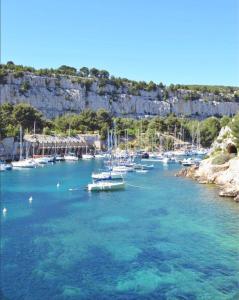 a group of boats docked in a body of water at Appartement Villa Cassis in Cassis