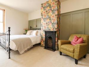 מיטה או מיטות בחדר ב-No 19, Haworth