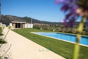 a swimming pool in the yard of a house at AgrellaMar - by TonsdeVerde in Braga