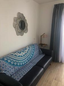 Un pat sau paturi într-o cameră la La Rosa Apartment Los Boliches Fuengirola Malaga Spain