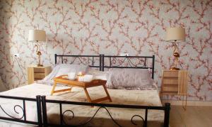 a bedroom with a bed with a table on it at La finestra sulla fiera in Bologna