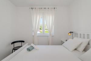 Postel nebo postele na pokoji v ubytování New and chic place near Old Town of Trogir