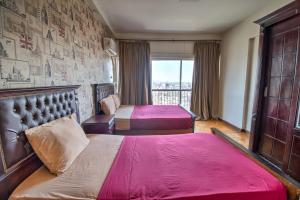 Ένα ή περισσότερα κρεβάτια σε δωμάτιο στο Castle Hostel