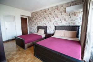 Ένα ή περισσότερα κρεβάτια σε δωμάτιο στο Castle Hostel