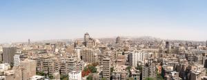 an aerial view of a city with tall buildings at Castle Hostel in Cairo
