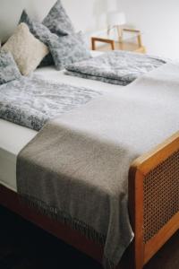 two beds sitting next to each other in a room at Heurigenhof Bründlmayer in Langenlois +22 photos