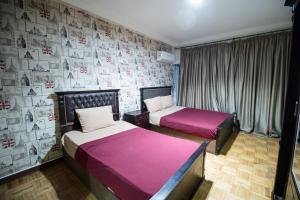 Ένα ή περισσότερα κρεβάτια σε δωμάτιο στο Castle Hostel