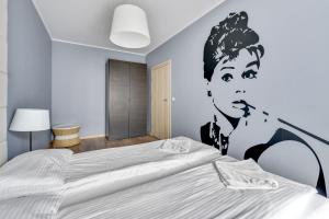 Łóżko lub łóżka w pokoju w obiekcie Grand Apartments - Szafuza Apartment Gdańsk Szafarnia