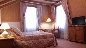 Кровать или кровати в номере Hotel Stelter