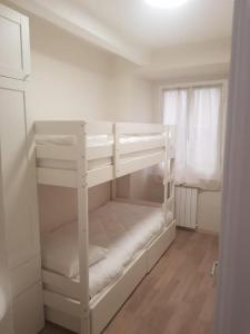 Posteľ alebo postele v izbe v ubytovaní Trilocale nel centro di Sampierdarena