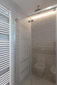 a bathroom with a glass shower with a toilet at Ilfico in Cannero Riviera