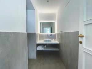 a bathroom with a sink and a mirror at Il Carrubo Capri in Anacapri