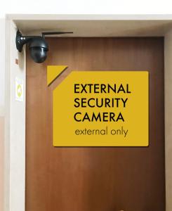 a sign on a door that reads external security camera at Lucky Home Near Train Station and City center in Verona
