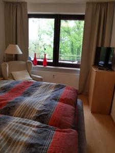 מיטה או מיטות בחדר ב-Appartementresidenz am Kurpark Bad Salzuflen