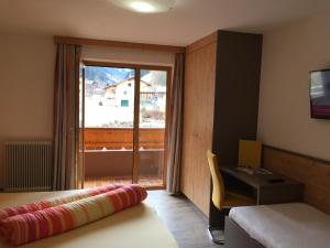 Letto o letti in una camera di Alpenecho