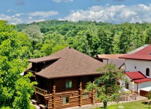 an overhead view of a log cabin with a roof at Casa Cartianu in Târgu Jiu