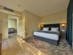 Кровать или кровати в номере Eleven Inn Tbilisi