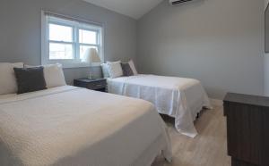 Postel nebo postele na pokoji v ubytování A Wave Inn - Montauk
