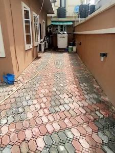 a hallway of a building with a tiled floor at luxury 4 bed rooms duplex lekki Lagos nigeria in Lekki